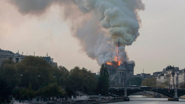 Flames rise during a fire at the landmark Notre Dame...