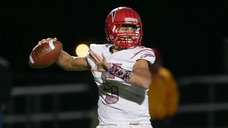 Connetquot's Drew Guttieri looks to pass in the third quarter during...