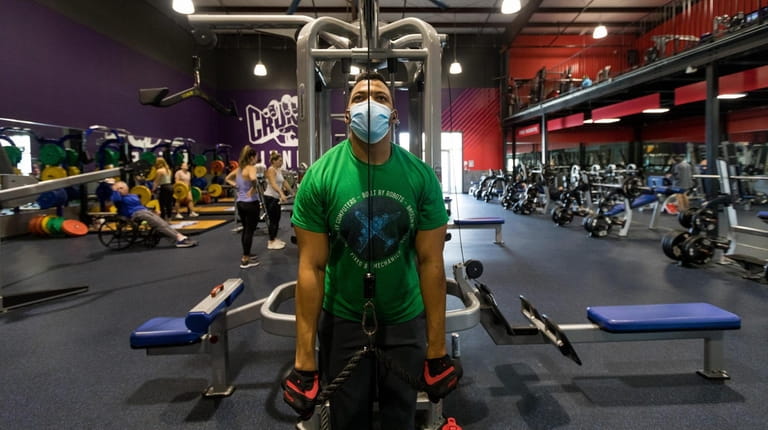 Joel Ledgister of Amityville, 32, works out at Crunch Fitness in...