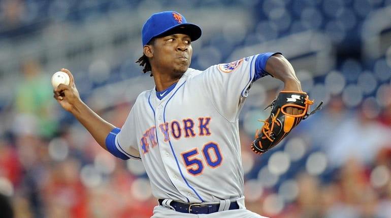 Rafael Montero #50 of the New York Mets pitches in...