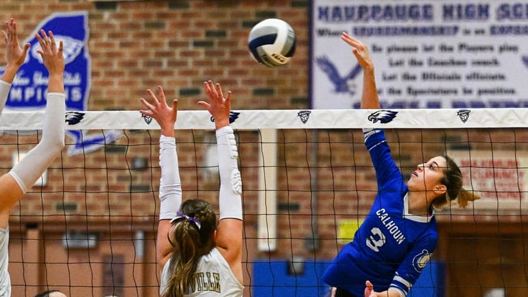Julia Lawrence gets one of her 10 kills against Sayville...