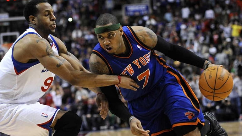 New York Knicks' Carmelo Anthony (7) drives past Philadelphia 76ers'...