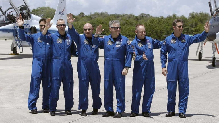 STS-134 crew members, from left, Mission Specialists Greg Chamitoff of...