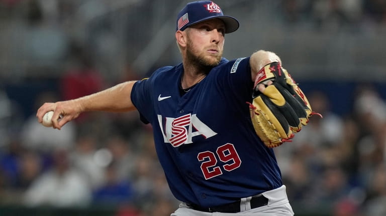 U.S. pitcher Merrill Kelly (29) aims a pitch during the...