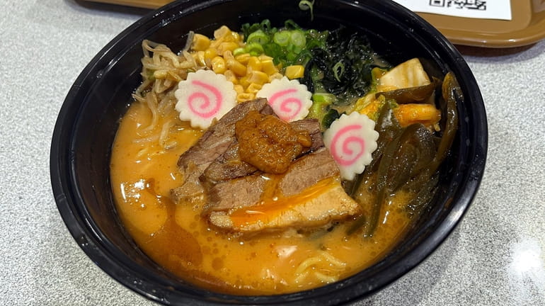 The spicy miso pork tonkotsu ramen features a 10-hour pork...
