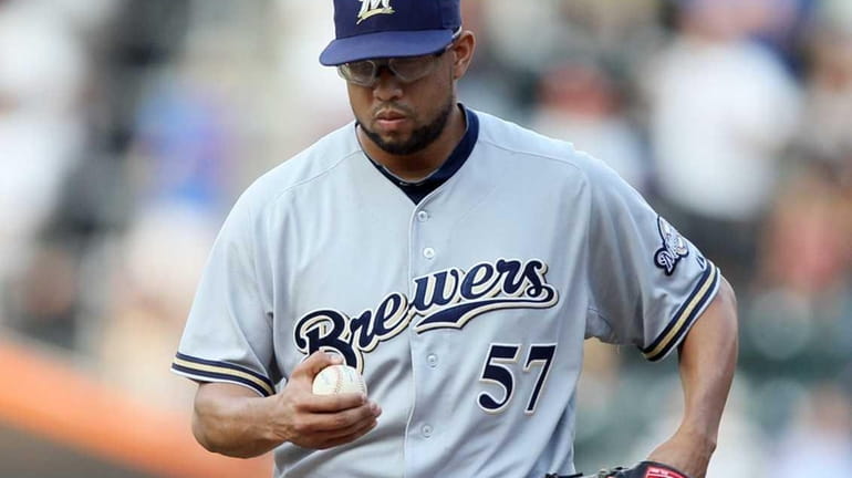 Francisco Rodriguez #57 of the Milwaukee Brewers looks on after...