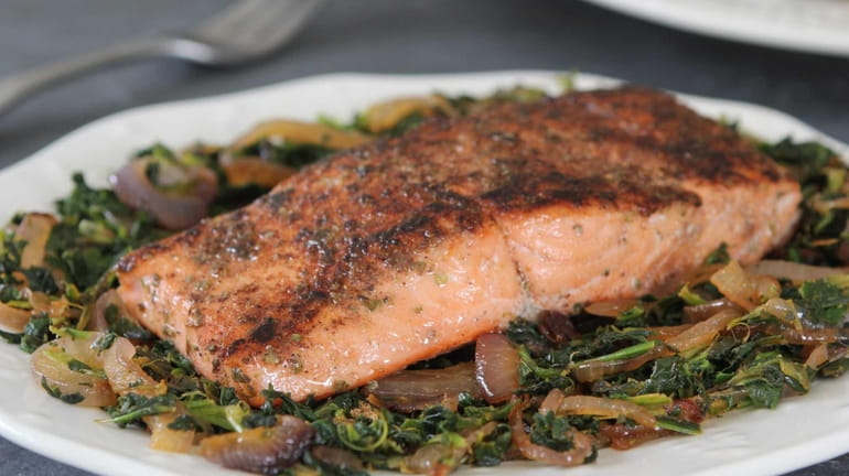 Spice-rubbed salmon on caramelized onion and spinach.