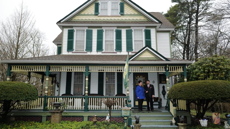 Barbara and Joseph Guidice's Amityville house, built in 1900, has stained-glass...