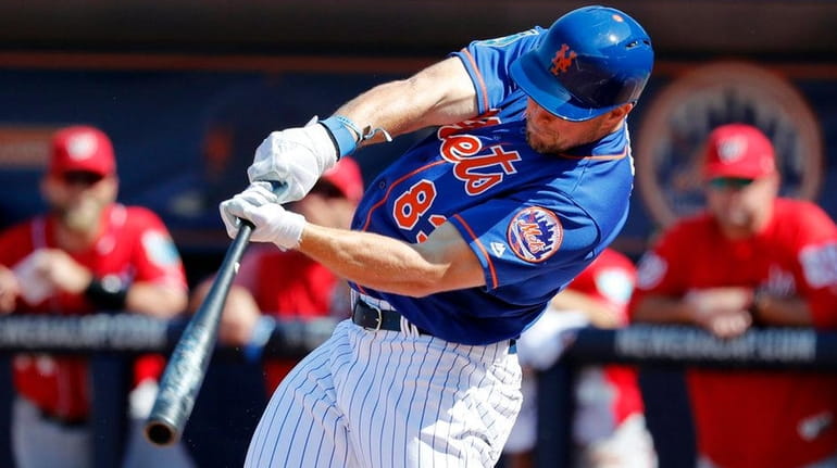 The Mets' Tim Tebow singles during the fourth inning of...