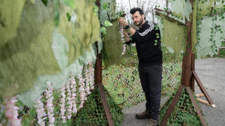 Set designer Joe Kenny builds a forest for the upcoming...