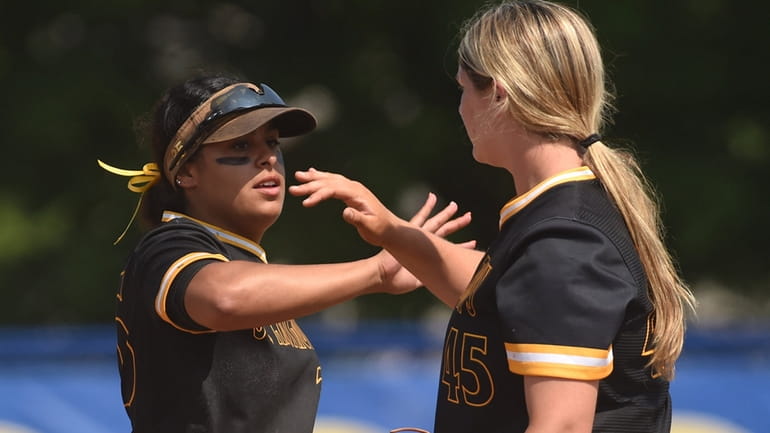 St. Anthony's Bella Cruz, left, and shortstop Jaclyn Morra in the...