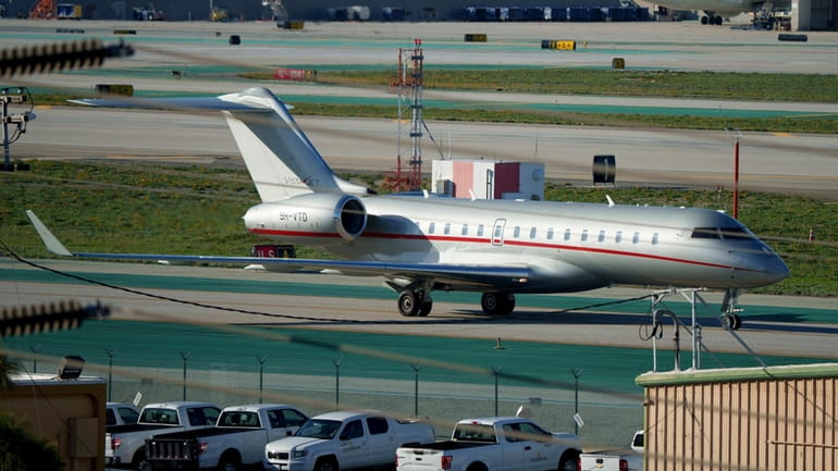 A VistaJet private jet, dubbed "The Football Era," with the...