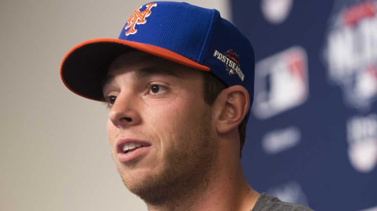 New York Mets starting pitcher Steven Matz (32) speaks to...