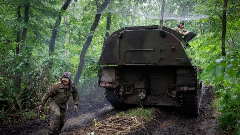 A Ukrainian army, German self-propelled Panzerhaubitze 2000, artillery drives to...
