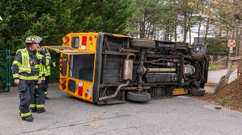 A minibus carrying a driver and one student overturned on County...