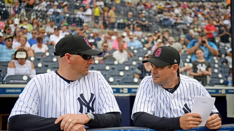 Josh Bard, usually the Yankees' bench coach, filled in for...