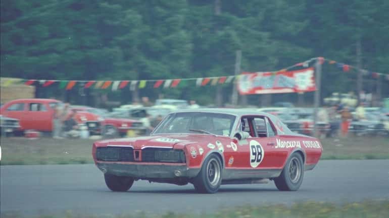 A 1967 Bud Moore Mercury Cougar is pictured driving at...