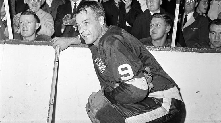 Gordie Howe of the Detroit Red Wings acknowledges applause from...