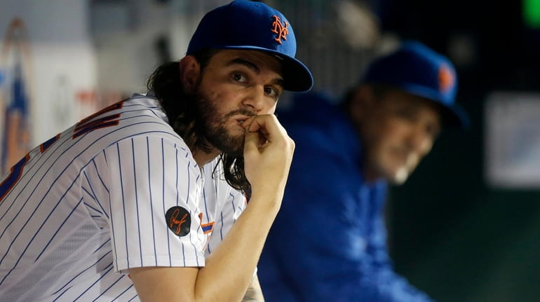 Robert Gsellman #65 of the New York Mets sits in...