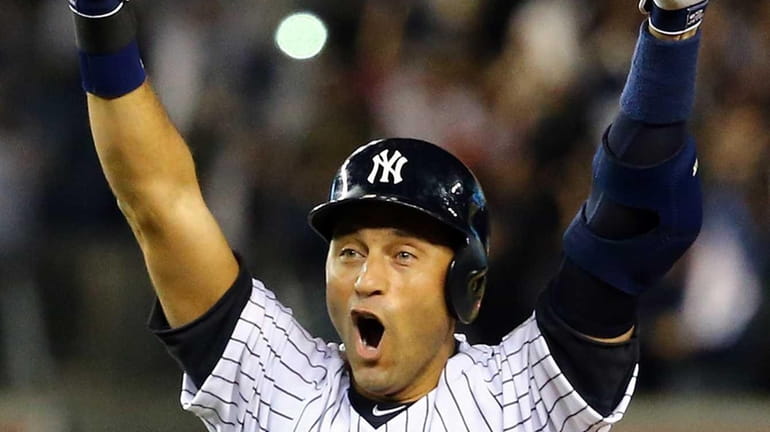 Derek Jeter of the Yankees celebrates after a game-winning RBI...