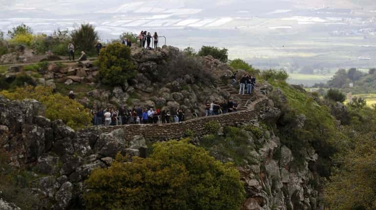Tourists visit the Saar Falls in the Israeli-annexed Golan Heights...