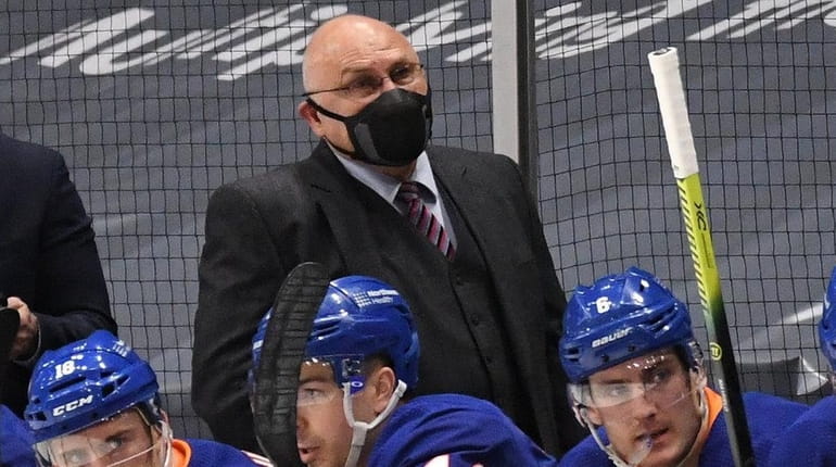 Islanders head coach Barry Trotz looks on in the second...