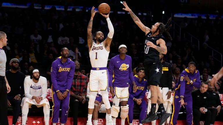 Los Angeles Lakers guard D'Angelo Russell (1) shoots next to...