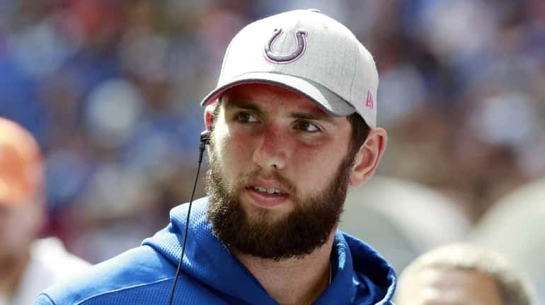 Indianapolis Colts quarterback Andrew Luck watches from the sideline during...