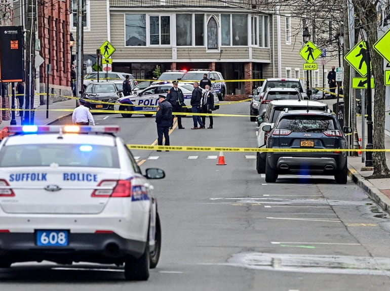 Suffolk County  police at the scene of a fatal shooting on...
