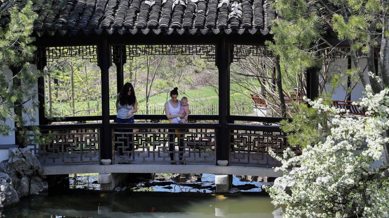 Visitors tour the Chinese Scholar's Garden at Snug Harbor on...