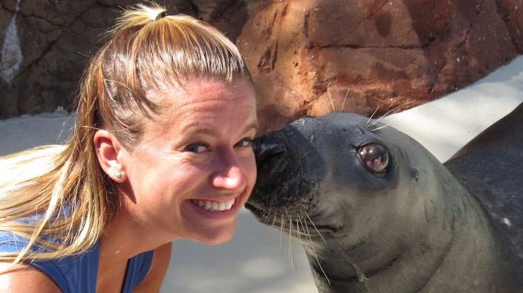 Caroline Walsh, a mammal trainer at Riverhead's Long Island Aquarium,...