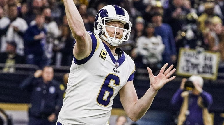 Rams punter Johnny Hekker fakes a punt and throws a...