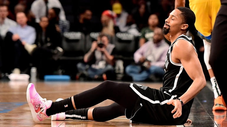 Spencer Dinwiddie #8 of the Nets reacts against the Bucks...