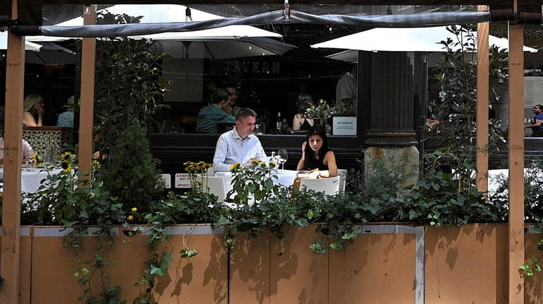 Diners are seated in the outdoor area at Gramercy Tavern on Friday....