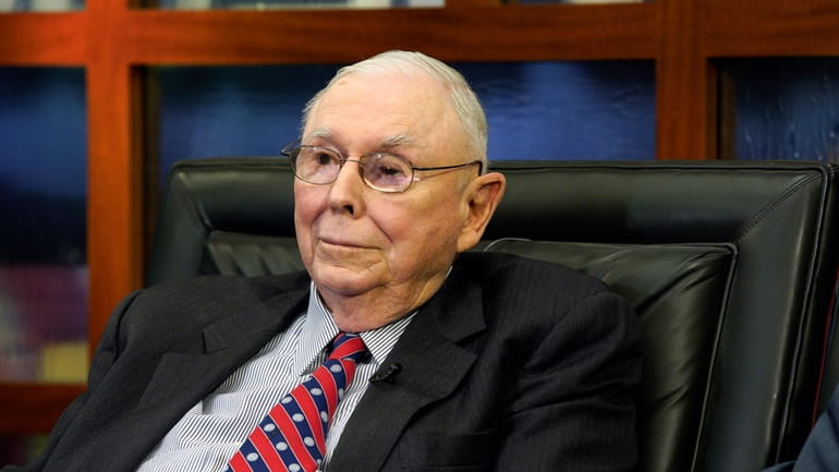 Berkshire Hathaway Vice Chairman Charlie Munger listens to a question...
