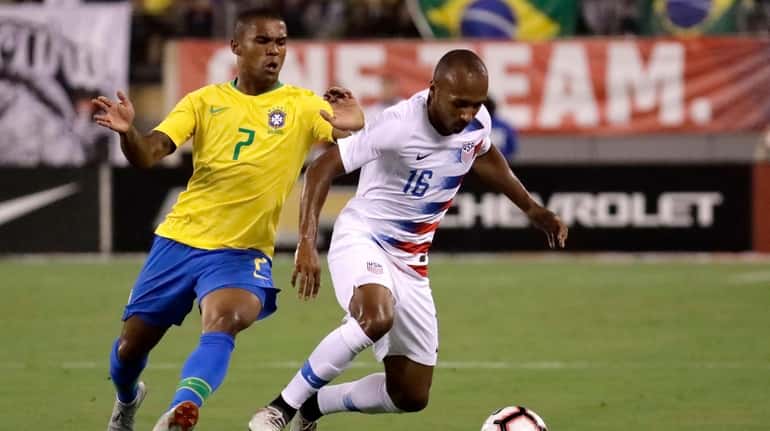United States midfielder Julian Green controls the ball as Brazil...