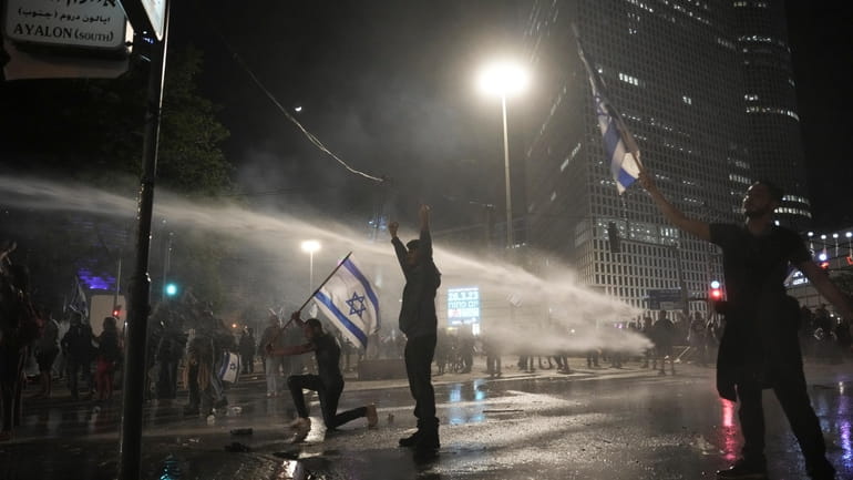 Police uses water canon to disperse anti government protesters in...