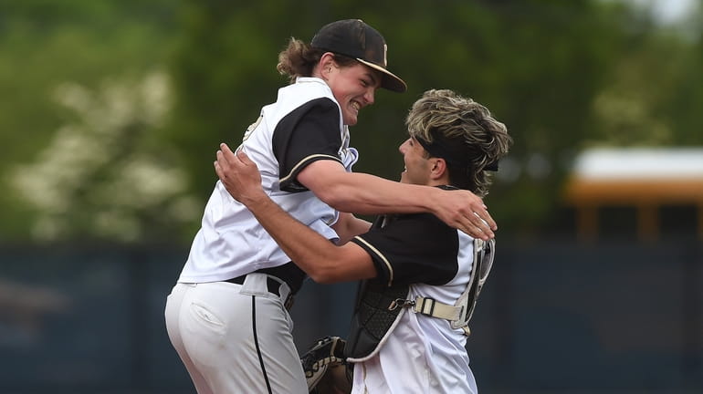 Pitcher Evan Kay leaps into Matthew Mayer’s arms after Commack...