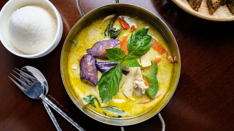 Green curry with chicken, eggplant, coconut milk, bamboo shoots, basil...