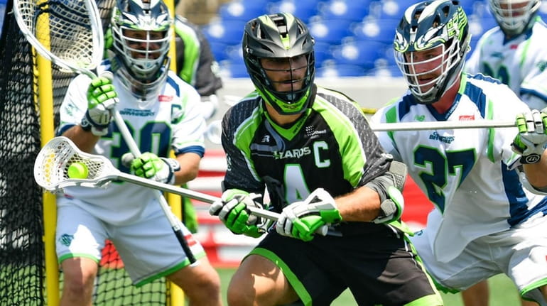 Dylan Molloy of the New York Lizards carries the ball...