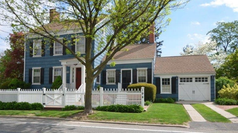 A Federal-style Colonial home in Huntington on the market for...