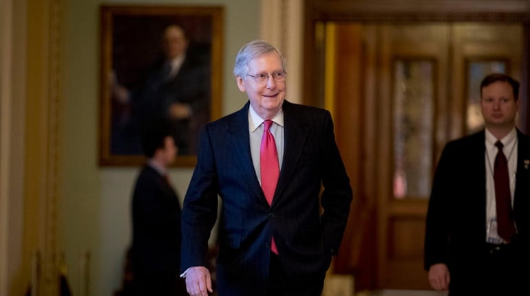 Senate Majority Leader Mitch McConnell (R-Ky.) on his way to...