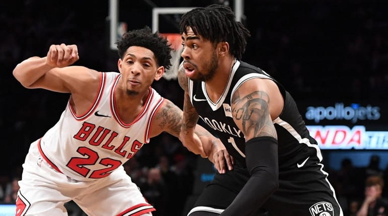 Brooklyn Nets guard D'Angelo Russell dribbles the ball against Chicago...