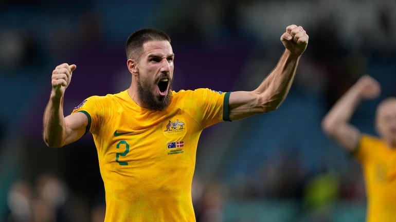 Australia's Milos Degenek celebrates his team victory during the World...