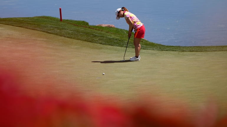 Ayaka Furue putts on the ninth green during the first...
