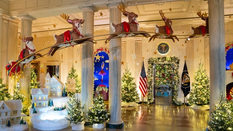 Holiday decorations adorn the Grand Foyer of the White House...