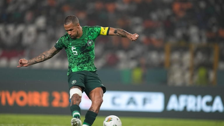 Nigeria's William Troost-Ekong scores from the penalty spot during the...