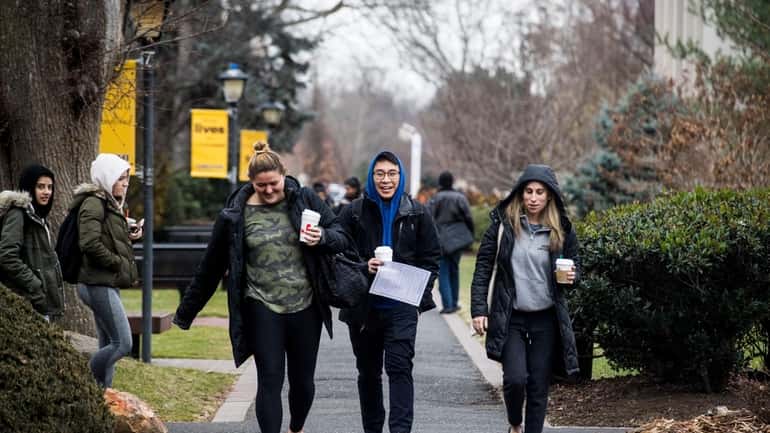 Students on the campus of Adelphi Univeristy in Garden City. College...