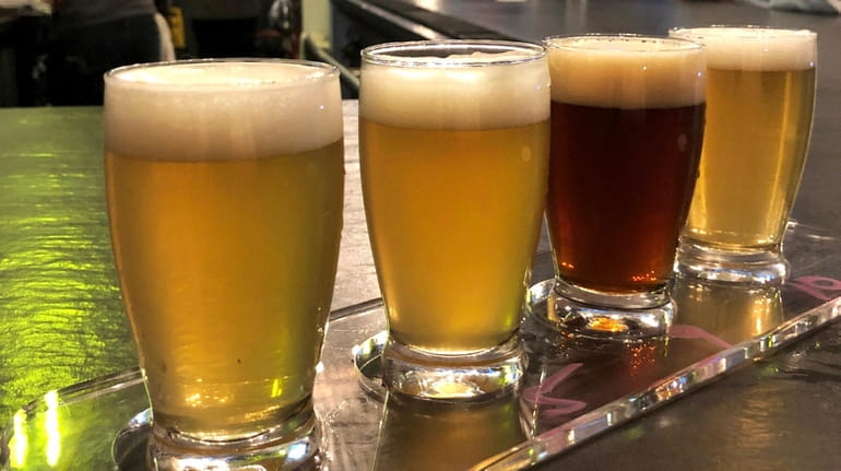 A beer sampling flight at Patchogue Beer Project, which opened...