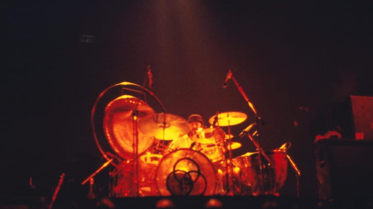 Drummer John Bonham takes a solo during Led Zeppelin's performance...